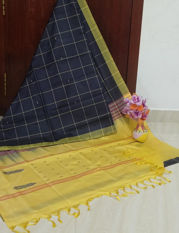 Elegant black saree with Mustard yellow pallu and blouse