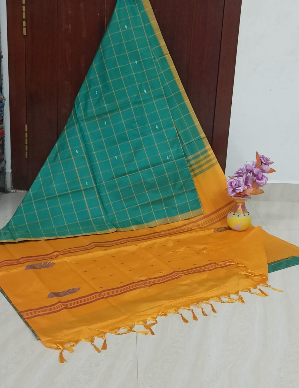 Teal green body with radiant mustard-orange pallu and blouse