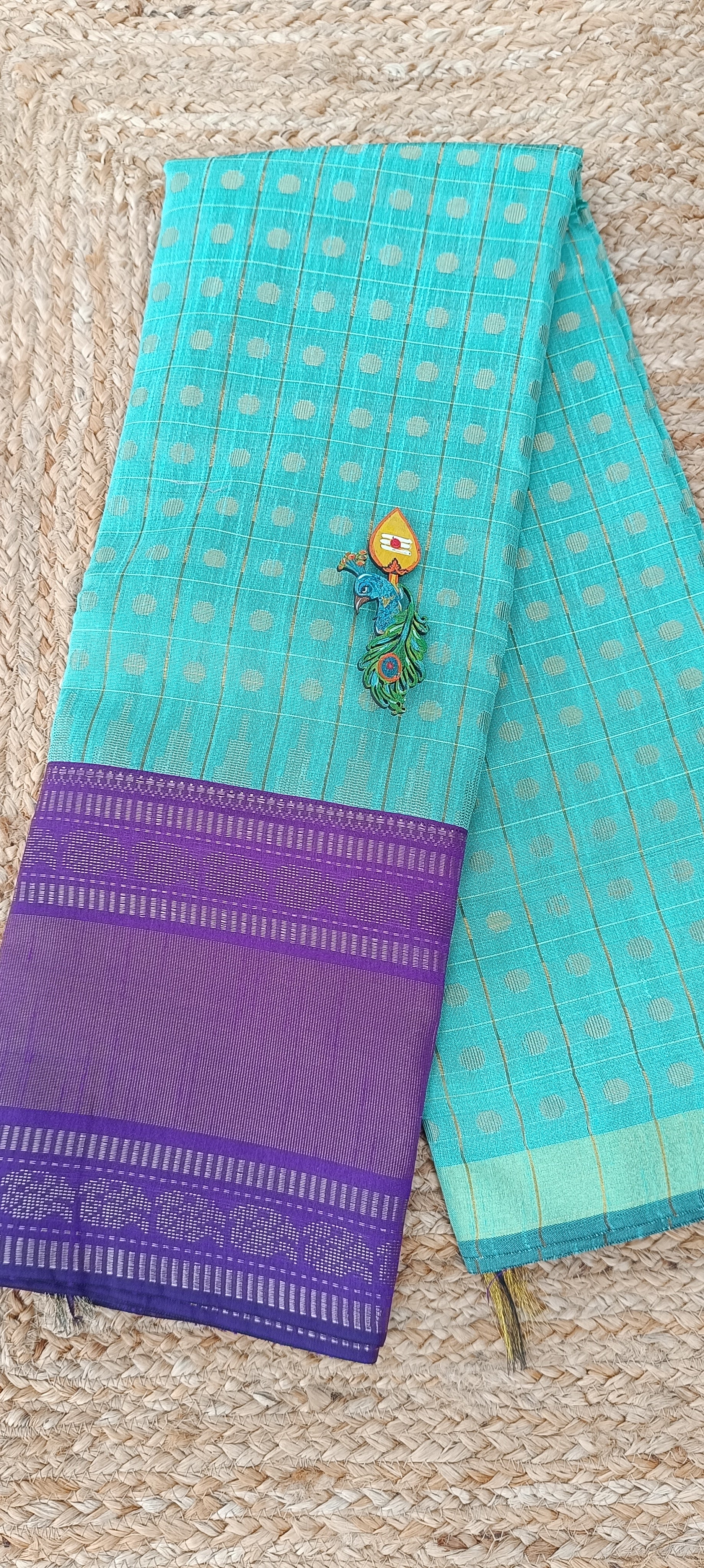Sky blue semi raw silk saree with purple border and pallu