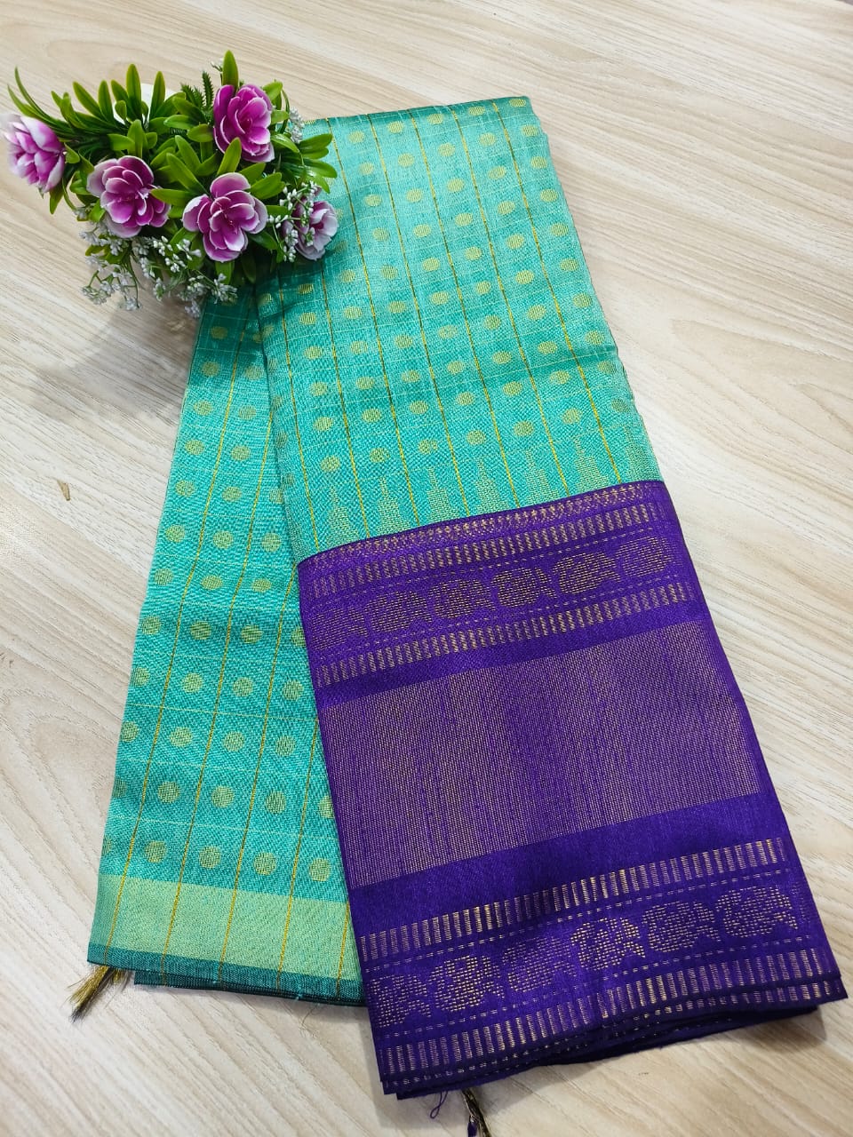 Sky blue semi raw silk saree with purple border and pallu
