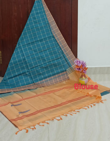Teal blue checked saree with light orange blouse
