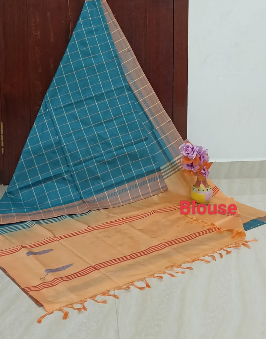 Teal blue checked saree with light orange blouse